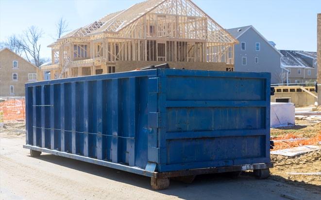 dumpster in driveway during home renovation project